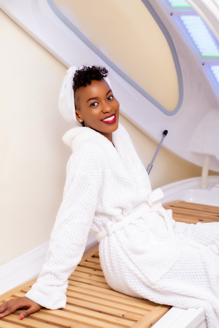 Close view of the ozone wellness capsule with a smiling guest