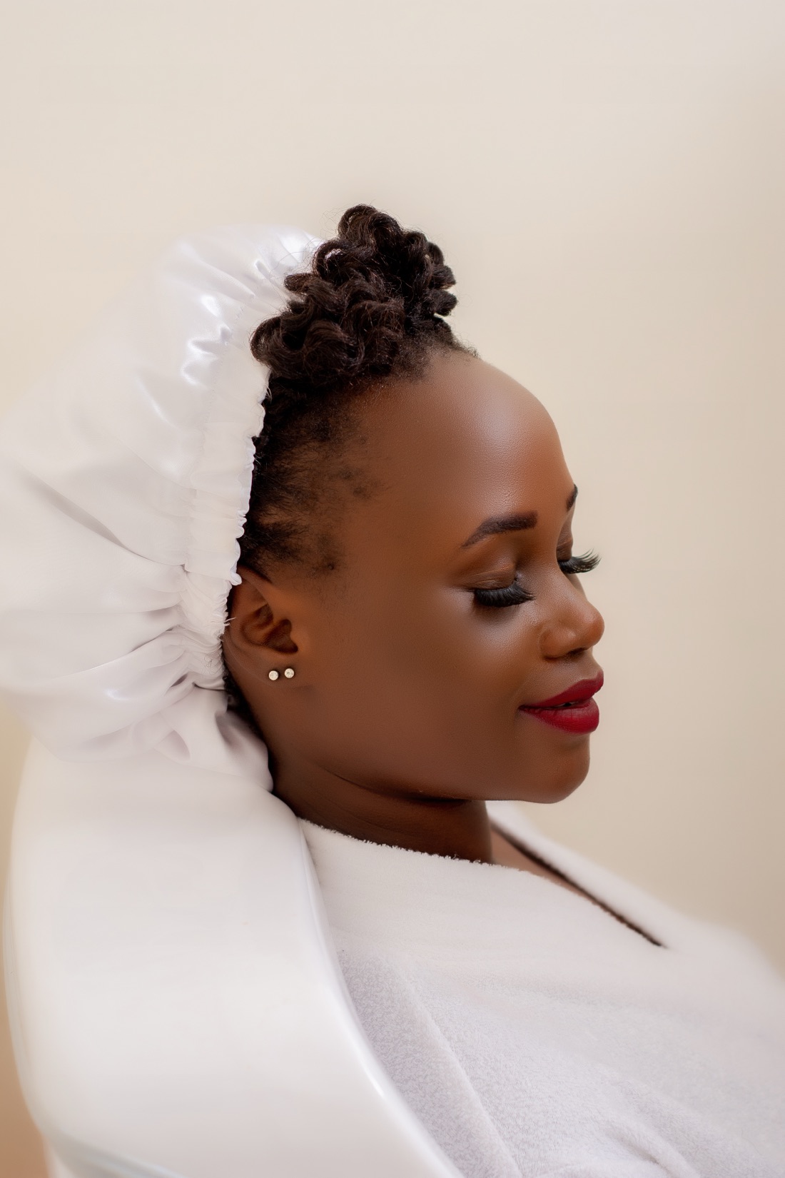 Close portrait of a guest in a spa headwrap